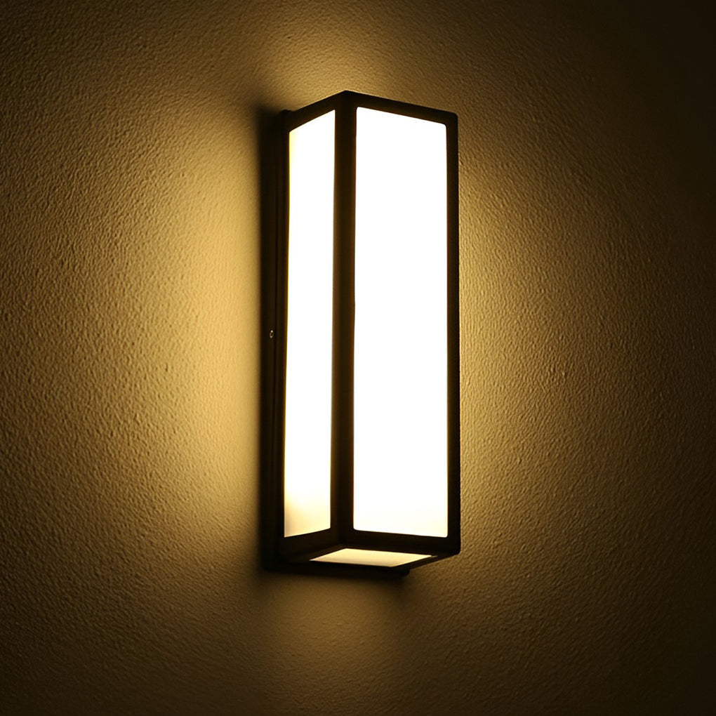 Contemporary outdoor wall light emitting warm ambient glow