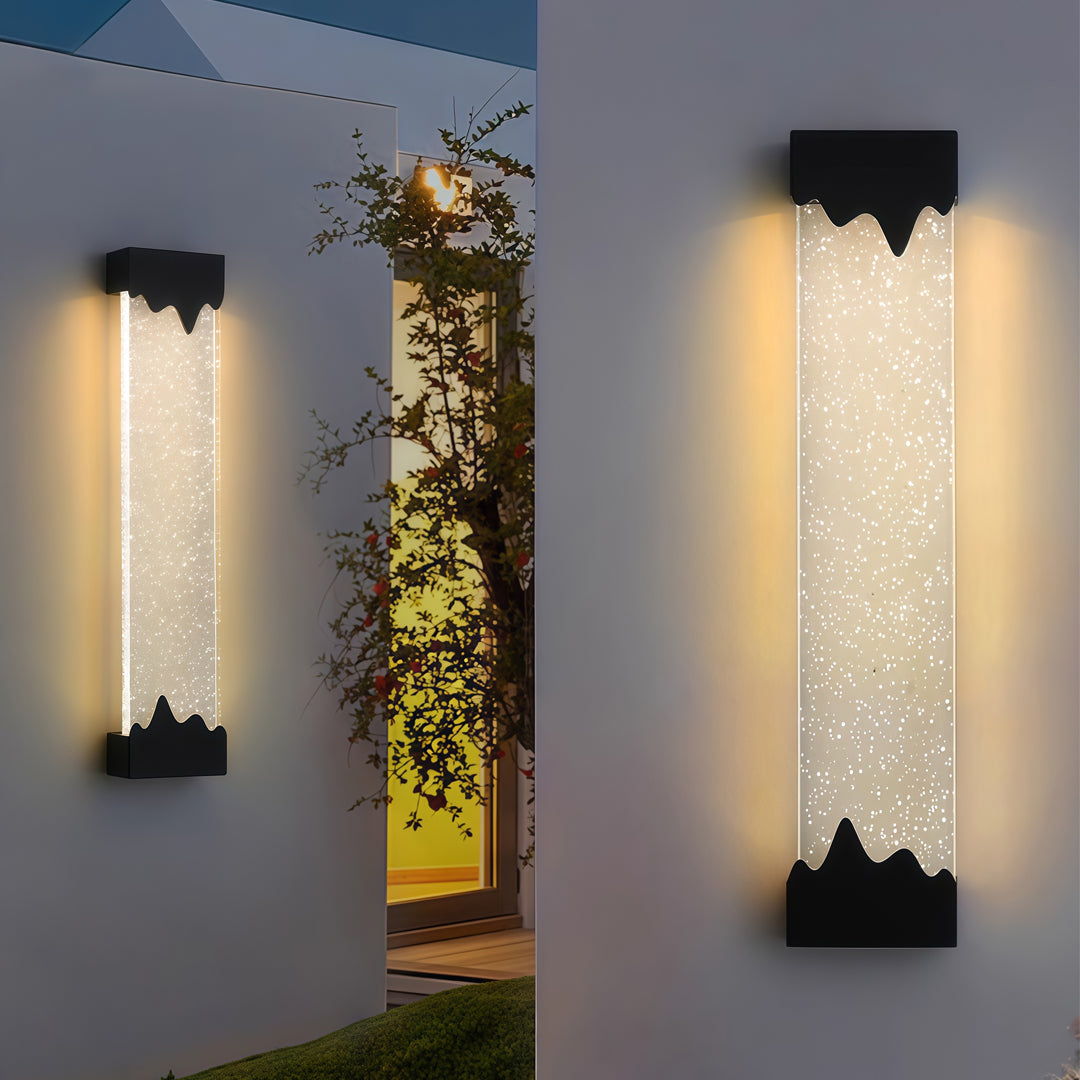Contemporary outdoor wall lighting black linear fixtures creating dramatic illumination on gray modern exterior wall