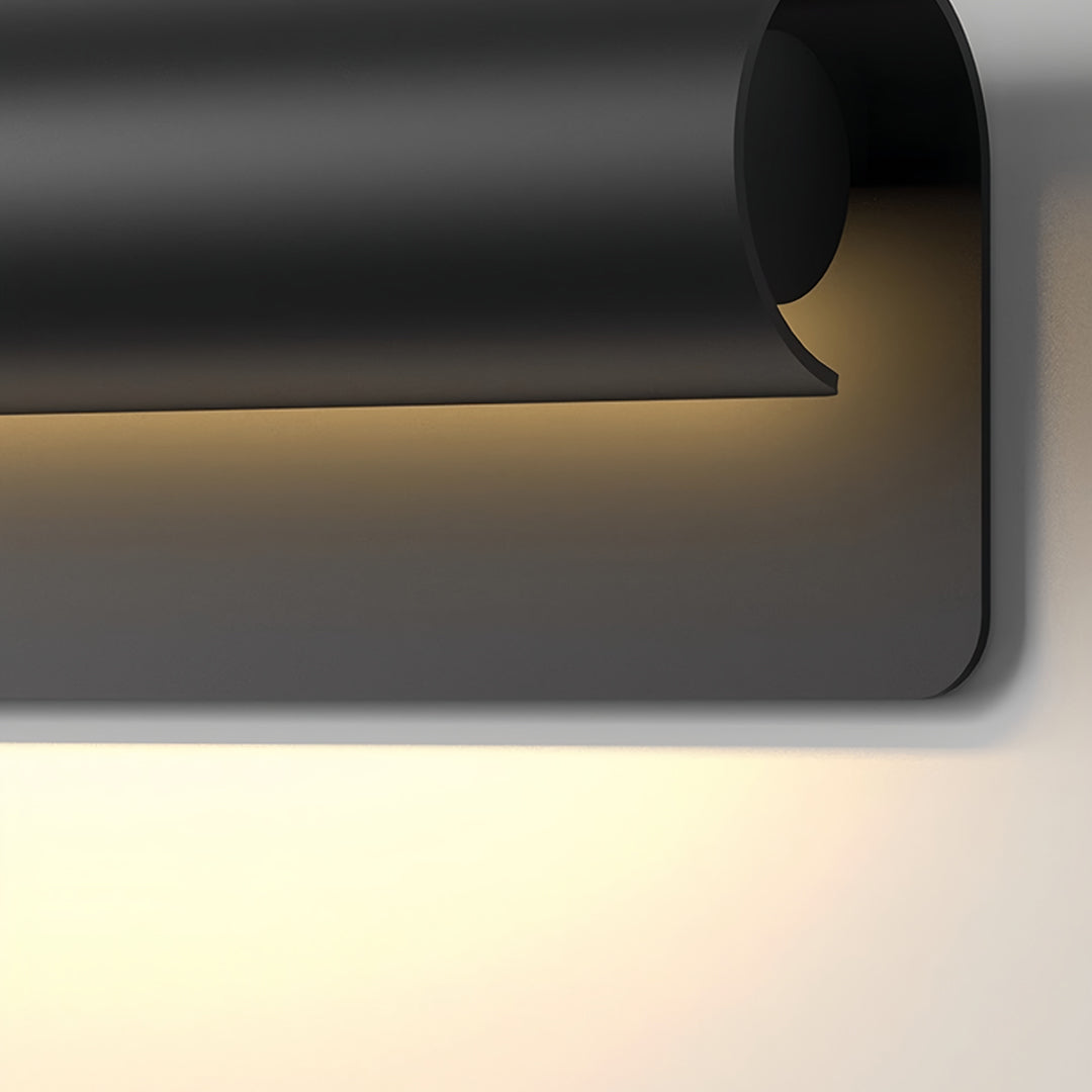 Contemporary outdoor wall lighting copper outdoor sconce closeup showcasing angular black design with warm light opening