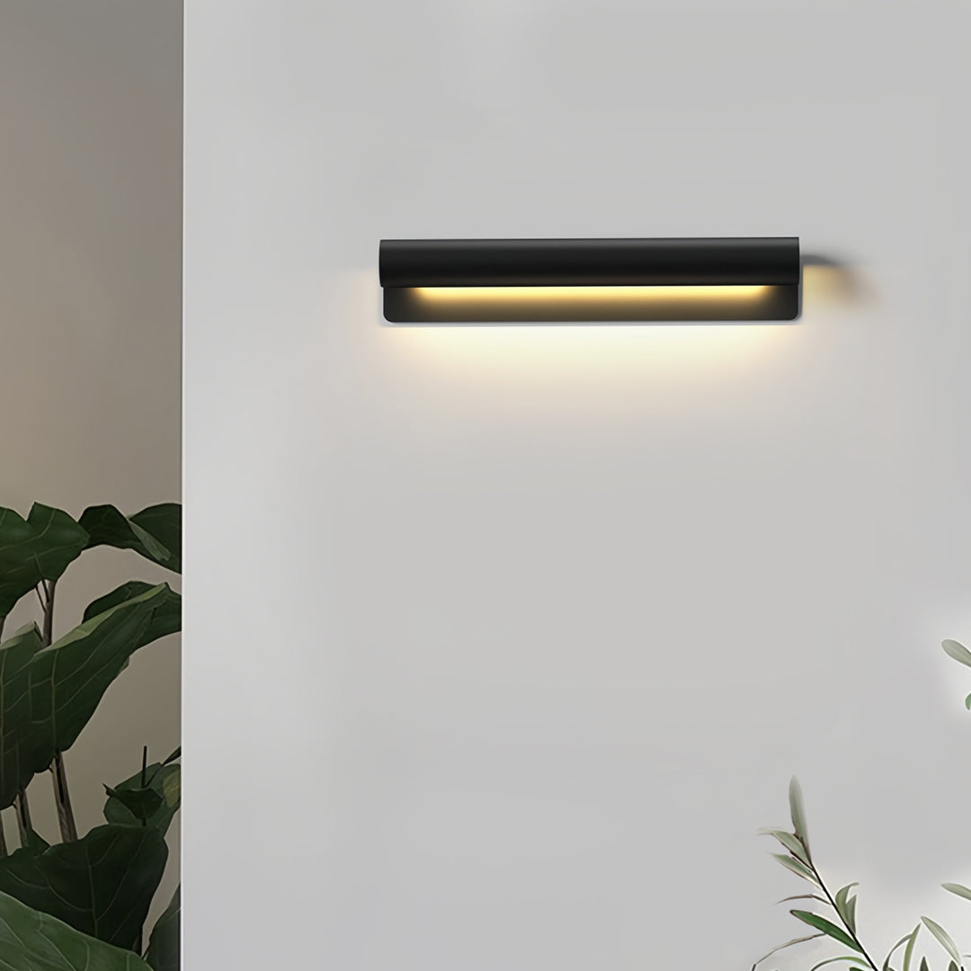 Contemporary outdoor wall lighting copper outdoor sconce mounted on gray wall with modern home decor setting