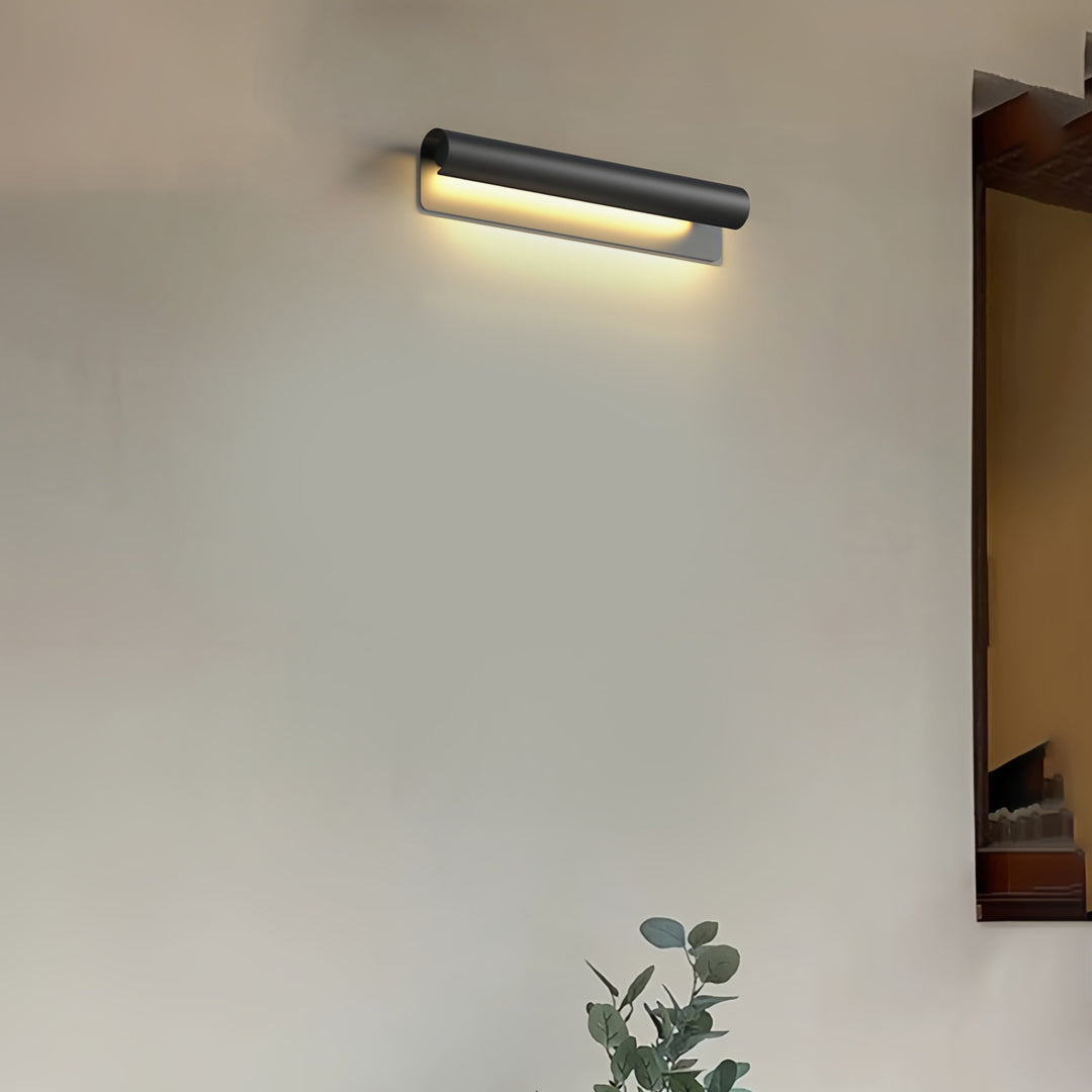 Contemporary outdoor wall lighting copper outdoor sconce on white wall with plant and warm modern interior lighting