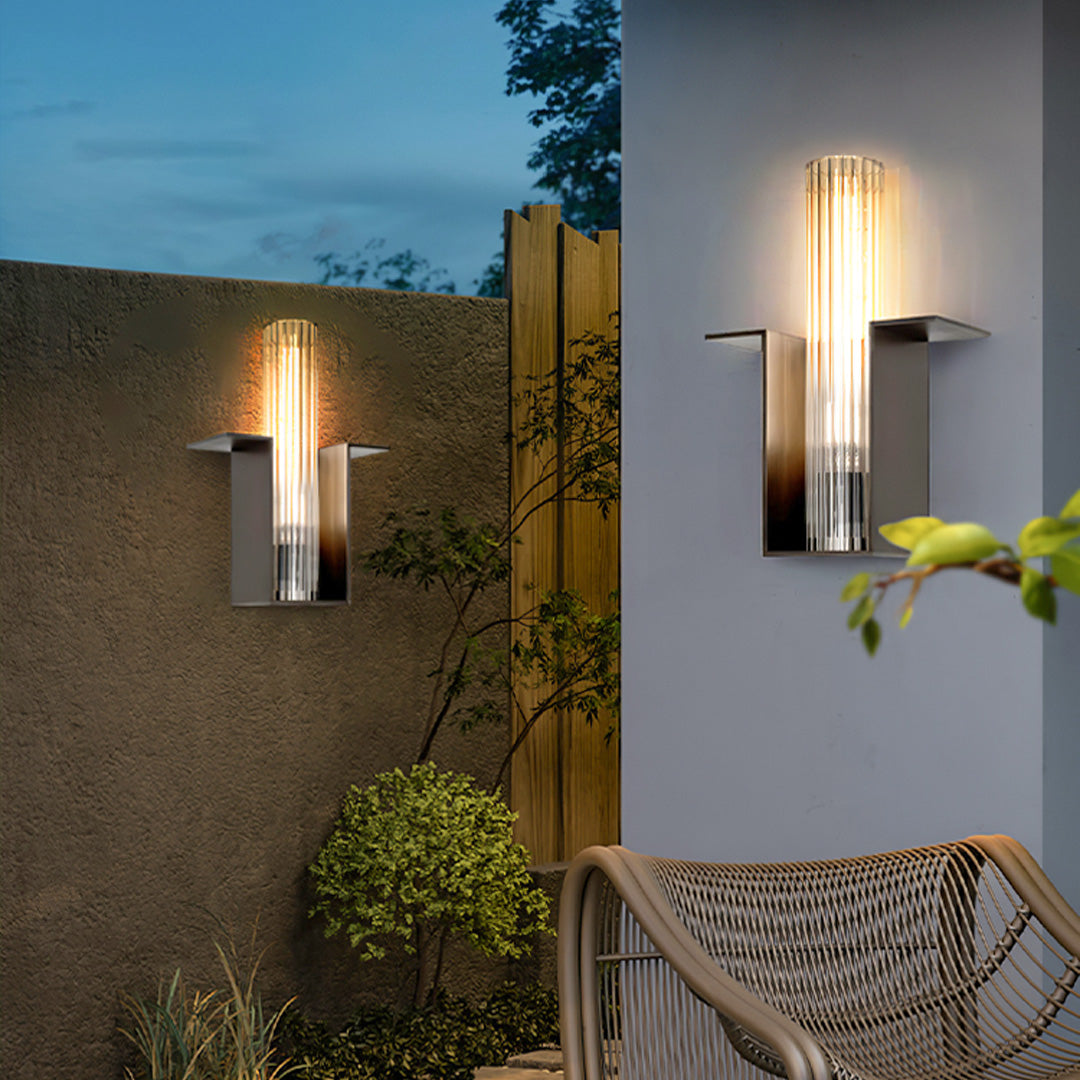 Contemporary outdoor wall lighting illuminating modern home entrance at dusk with warm ambient glow