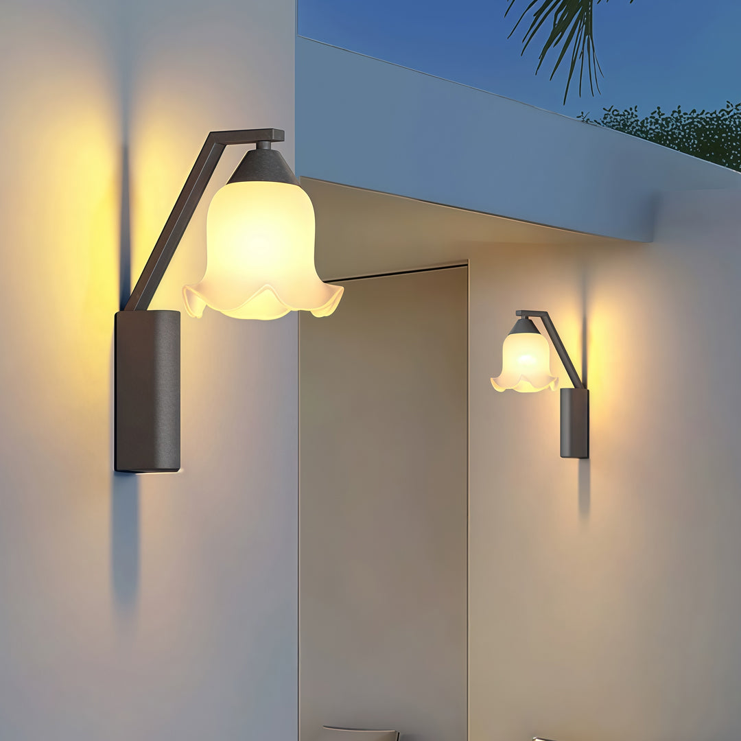Contemporary outdoor wall lighting flower wall sconces pair on white modern exterior walls at blue hour twilight