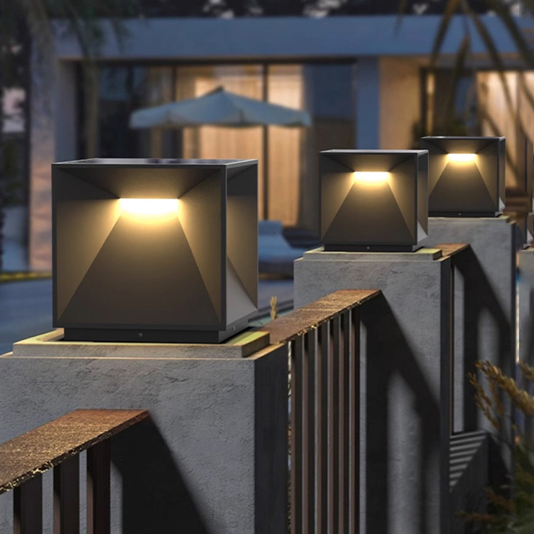 Contemporary outdoor wall lighting garden pillar lights mounted on modern stone columns with evening landscape illumination