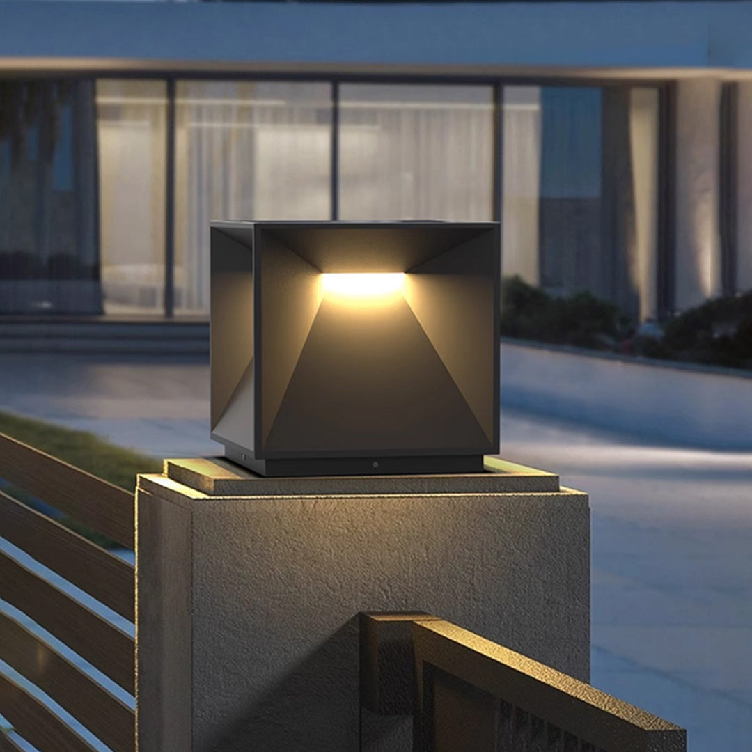 Contemporary outdoor wall lighting garden pillar lights on stone pillars creating warm ambient outdoor evening lighting