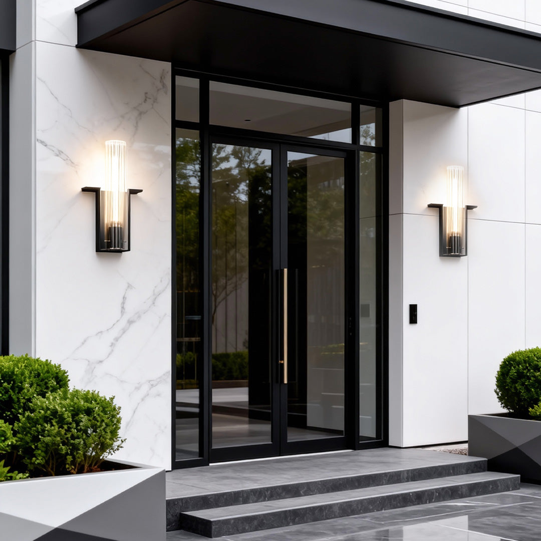 Contemporary outdoor wall lighting pair flanking glass front door on white contemporary home exterior
