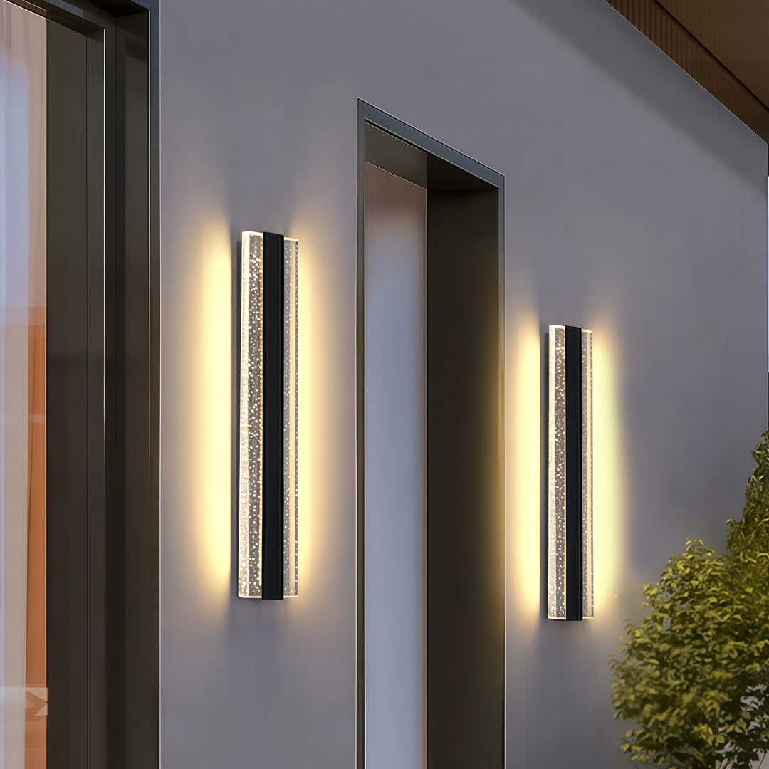 Contemporary outdoor wall lighting linear fixtures pair creating dramatic accent lighting on dark modern facade