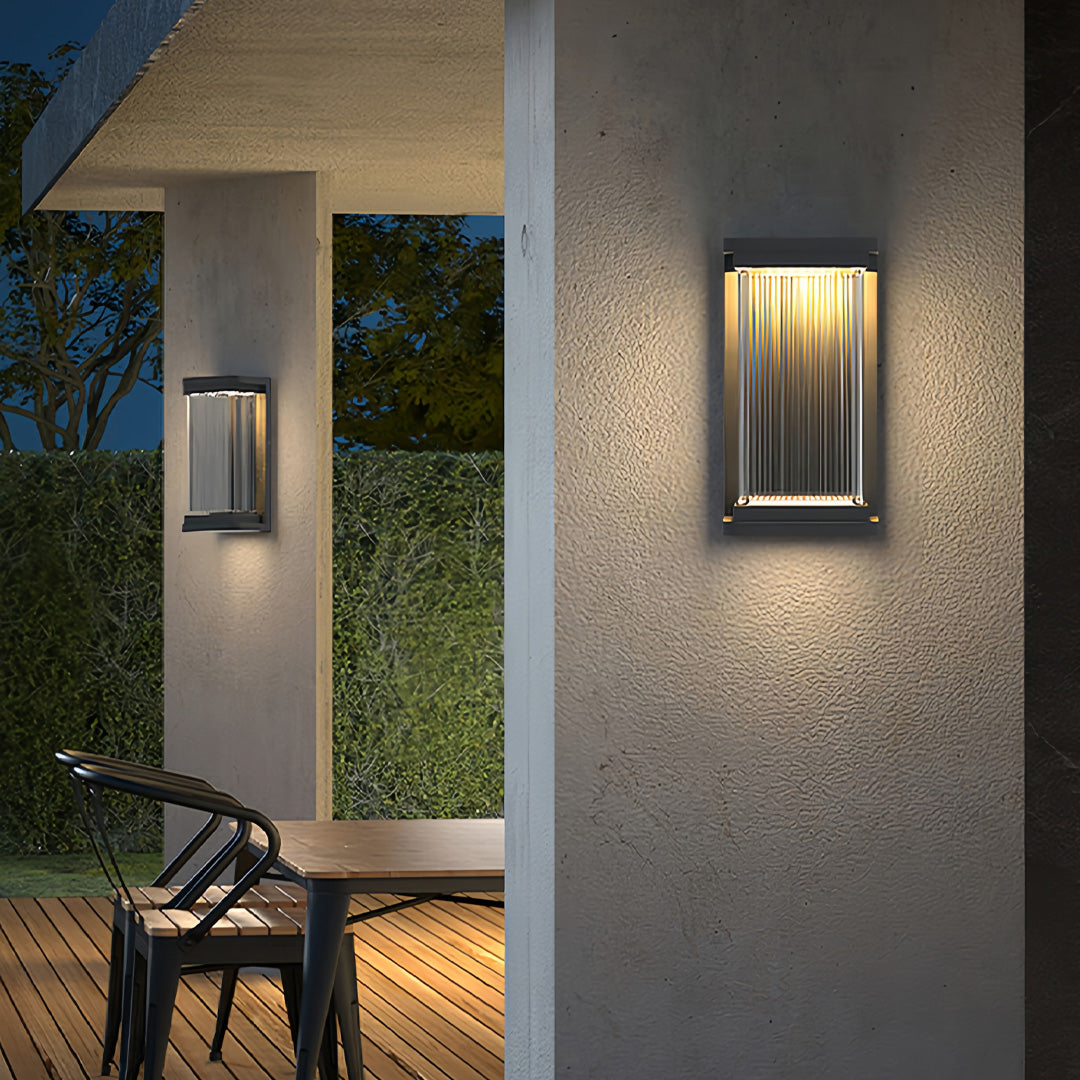 Contemporary outdoor wall lighting modern linear sconce with dual illumination on textured stone facade