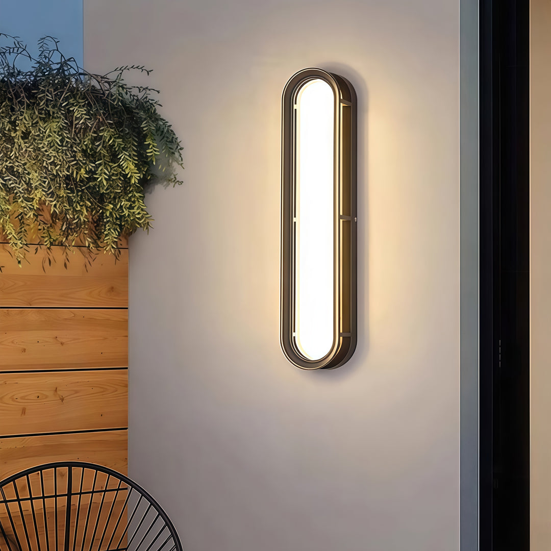 Contemporary outdoor wall lighting wall mounted linear light on beige wall beside wooden furniture and greenery