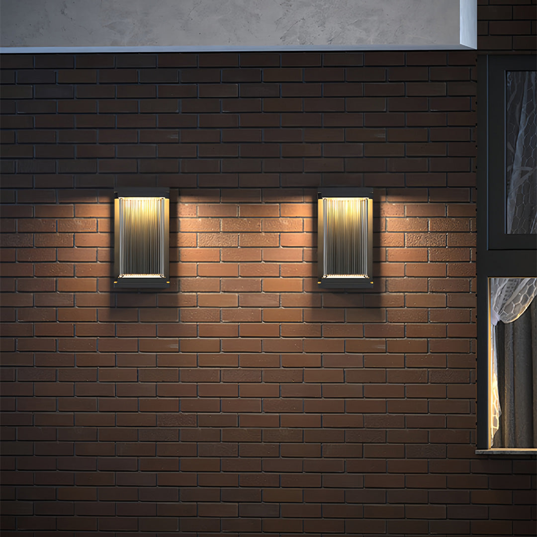 Contemporary outdoor wall lighting linear sconces pair mounted on horizontal wood slat exterior wall