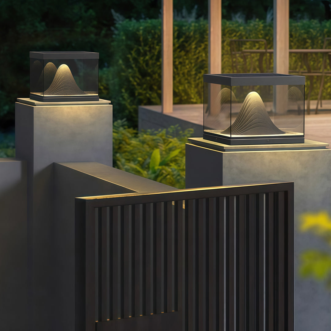 Contemporary outdoor wall lighting pillar fixture illuminating modern architectural column with warm evening ambiance