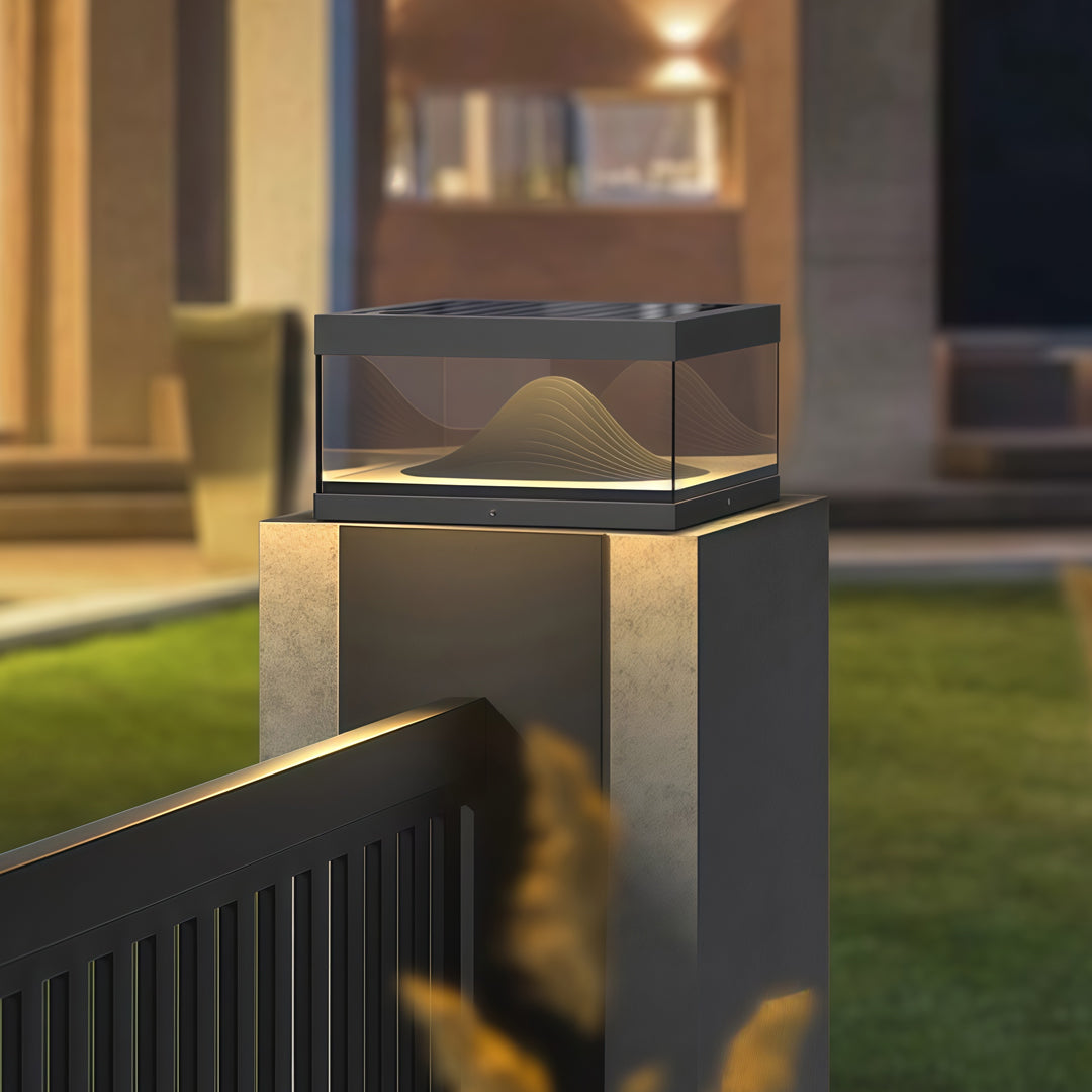 Contemporary outdoor wall lighting pillar fixtures on modern concrete pillars beside pool at twilight blue hour