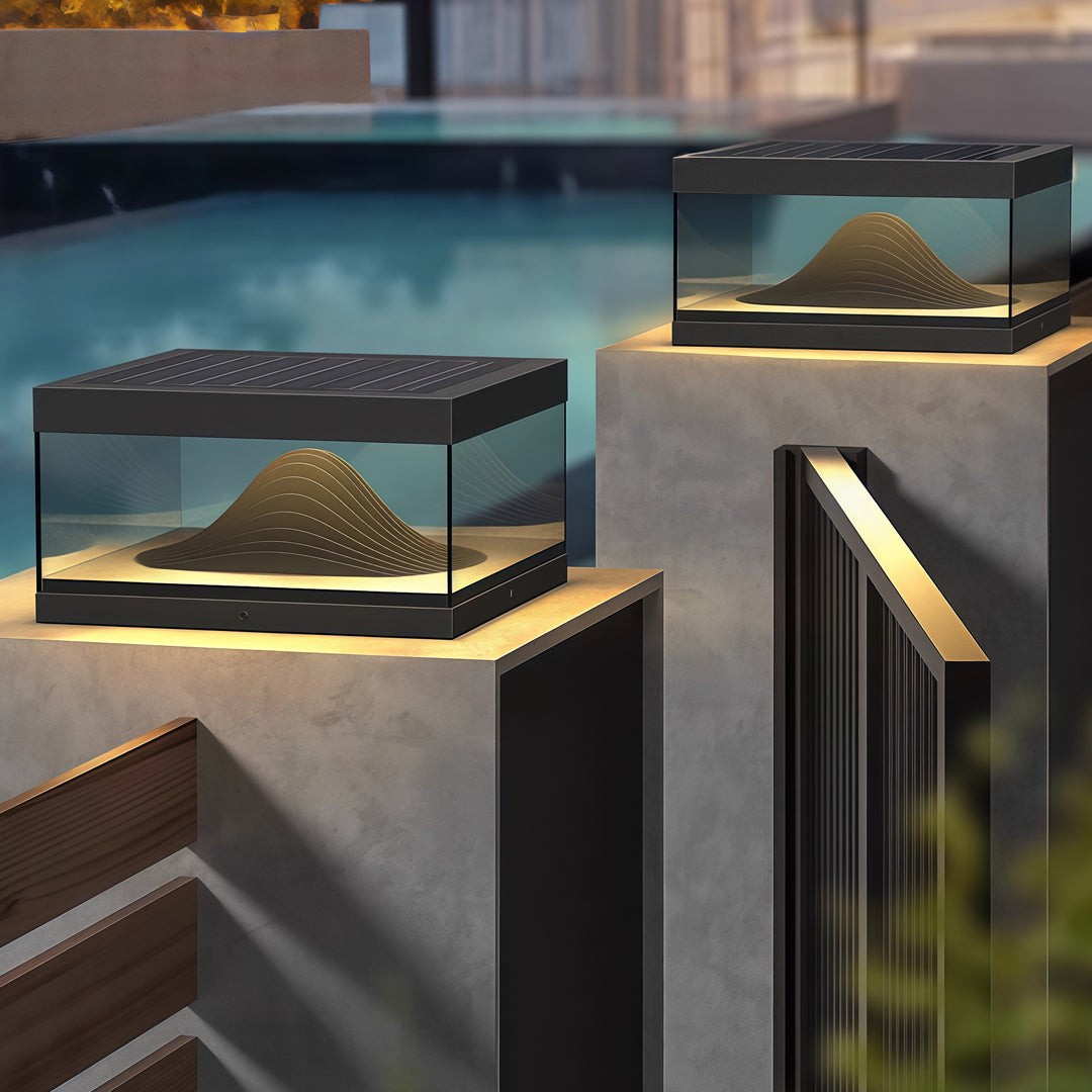 Contemporary outdoor wall lighting pillar fixtures on modern concrete pillars beside pool at twilight blue hour