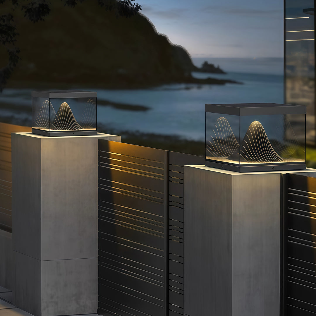 Contemporary outdoor wall lighting pillar fixtures on modern concrete pillars beside pool at twilight blue hour