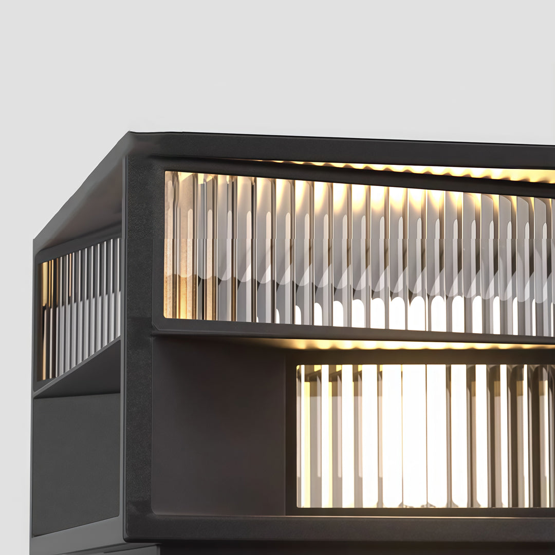 Contemporary outdoor wall lighting pillar LED fixture showcasing linear glass detail on modern dark exterior wall