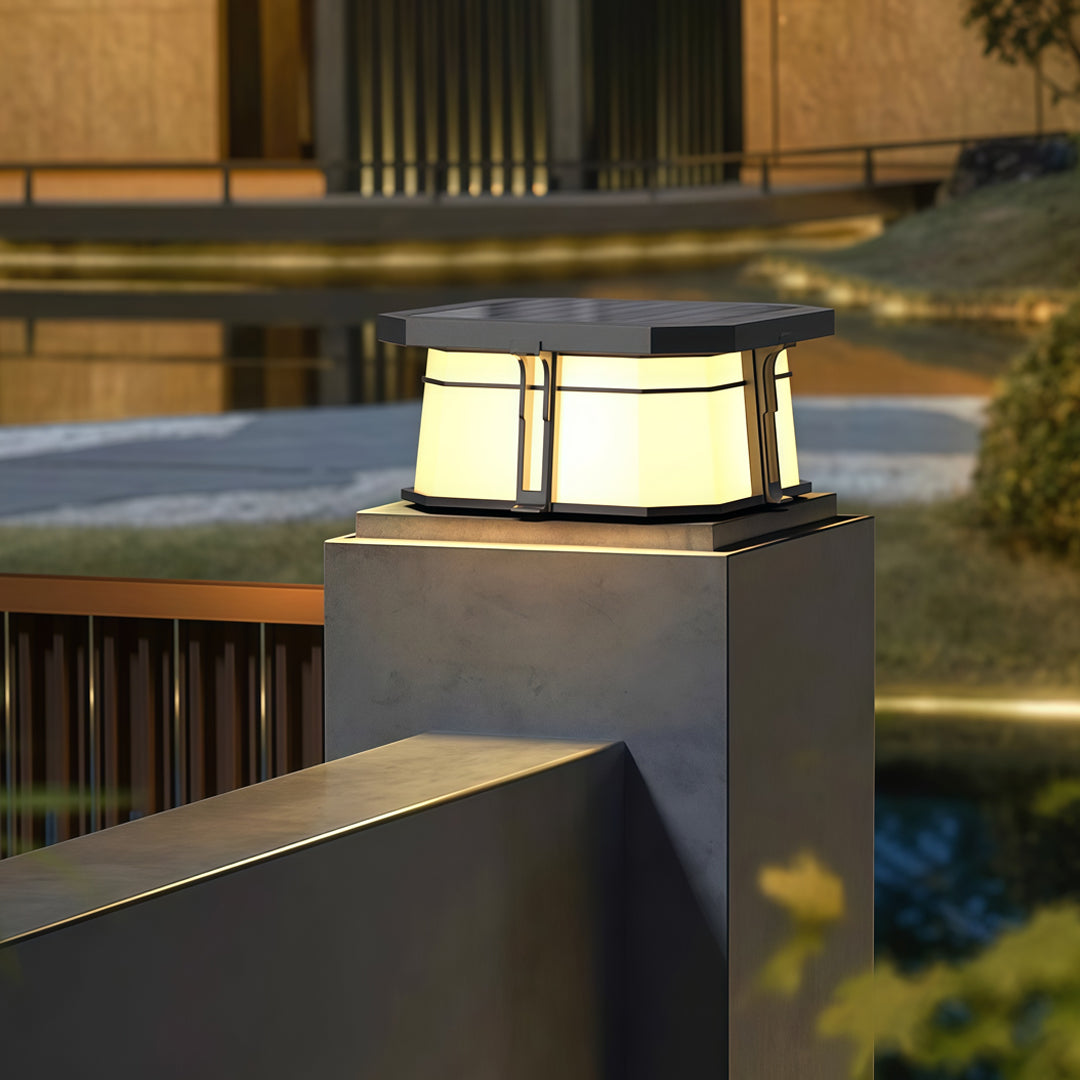 Contemporary outdoor wall lighting for pillar tops creating warm ambient glow on modern architectural pillars