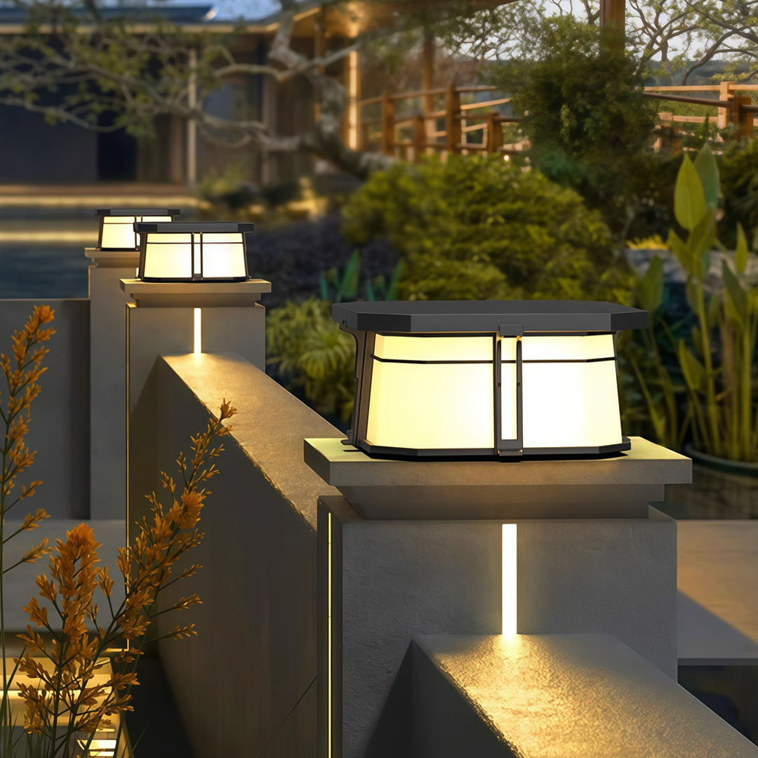 Contemporary outdoor wall lighting pillar top fixture mounted on modern concrete column at golden hour