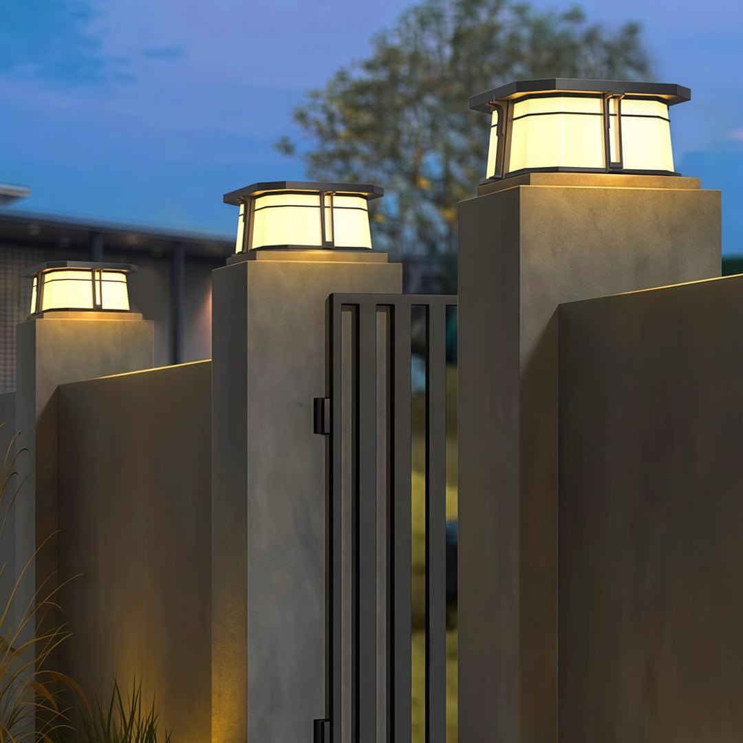 Contemporary outdoor wall lighting for pillar tops mounted on modern concrete columns at twilight landscape