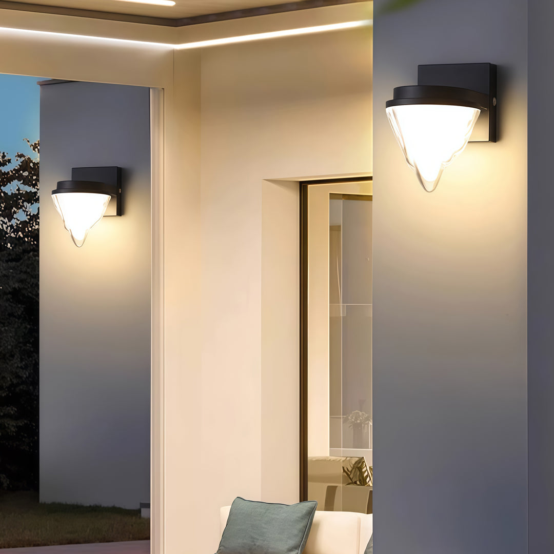 Contemporary outdoor wall lighting square wall sconce mounted on beige interior wall beside bathroom entrance