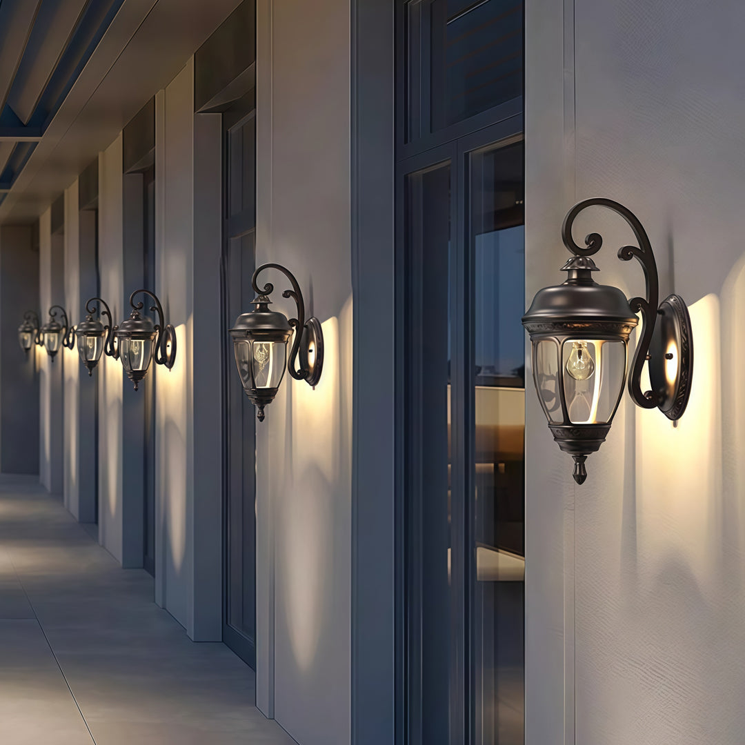 Contemporary outdoor wall lighting vintage sconce lamps mounted on modern white commercial building columns at dusk