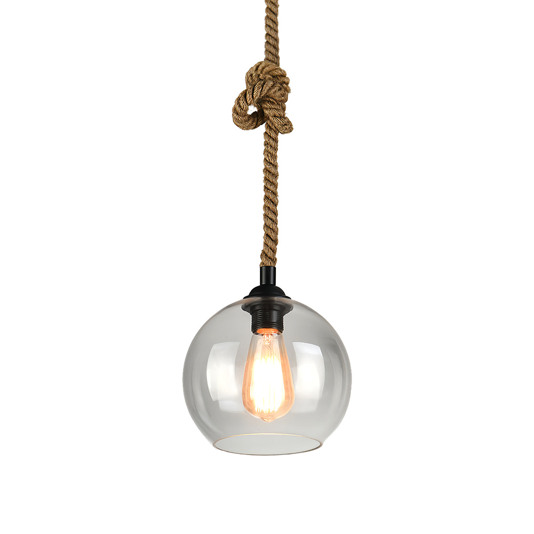 Contemporary retro glass pendant light featuring clear transparent globe with Edison bulb.