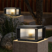 Contemporary solar outdoor pillar light installed on deck pathway with automatic LED illumination and modern design