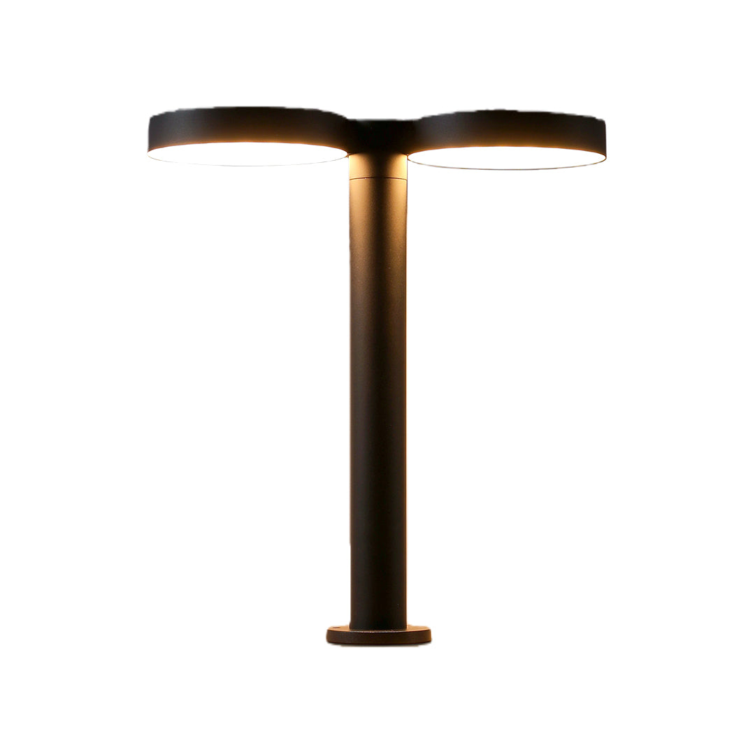 Contemporary solar path light mounted along a beautiful flower bed, enhancing the outdoor ambiance.