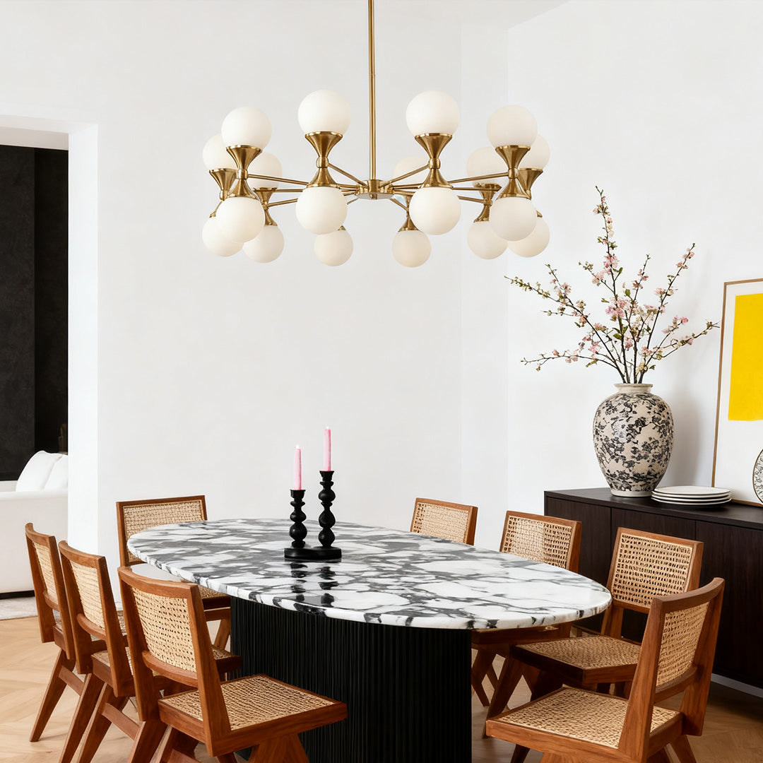 Contemporary bubble glass chandeliers suspended over a bright kitchen island, providing sparkling LED light through the decorative glass elements.