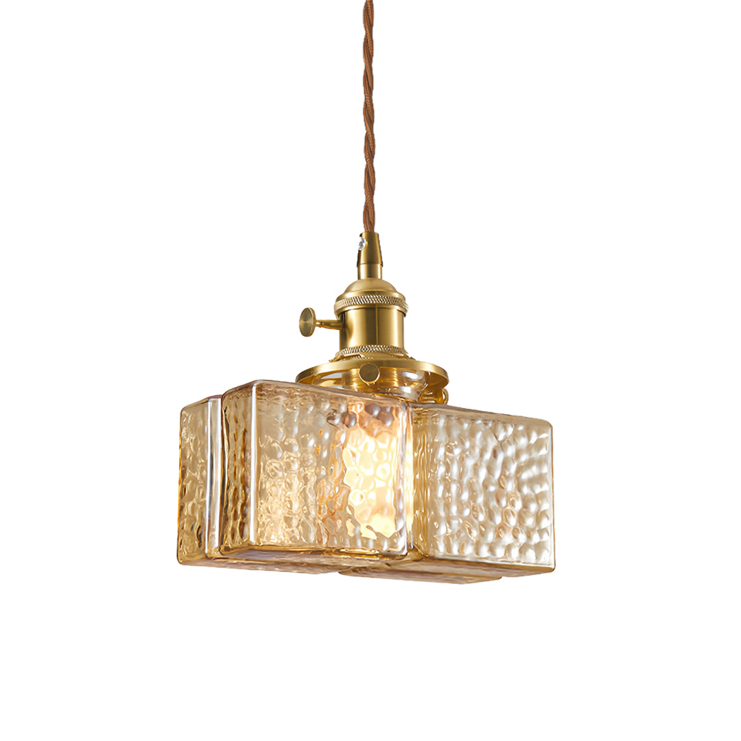 Contemporary square glass pendant light with fluted glass shade and brass accents for stylish interior lighting