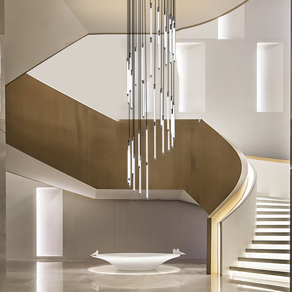 Contemporary staircase chandelier with cascading lights, creating a focal point in a modern foyer.