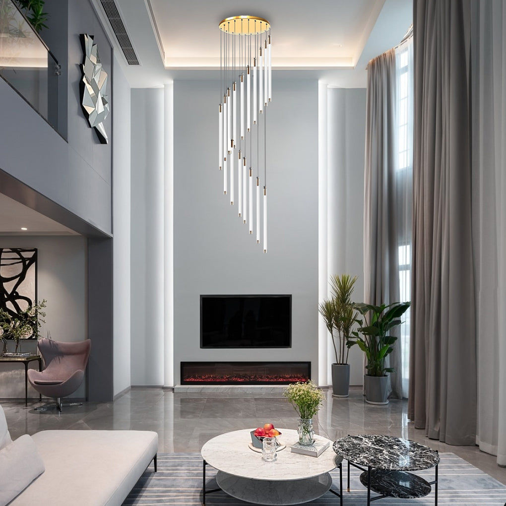 Contemporary staircase chandelier illuminating a spiral staircase with warm, ambient lighting.