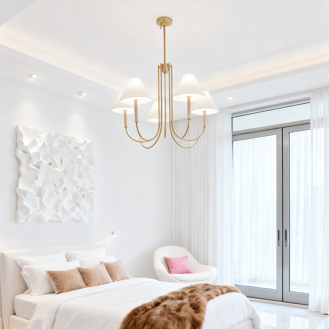 Contemporary white bedroom with a statement piece cloth shade chandelier adding warmth above the bed.