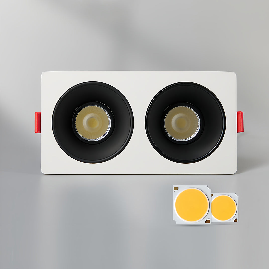 Contemporary triple square recessed downlight with black interior and white housing