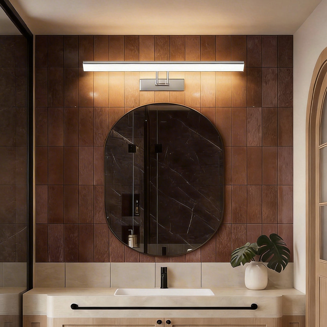 Contemporary vanity light bar with a sleek design, illuminating a modern bathroom mirror.