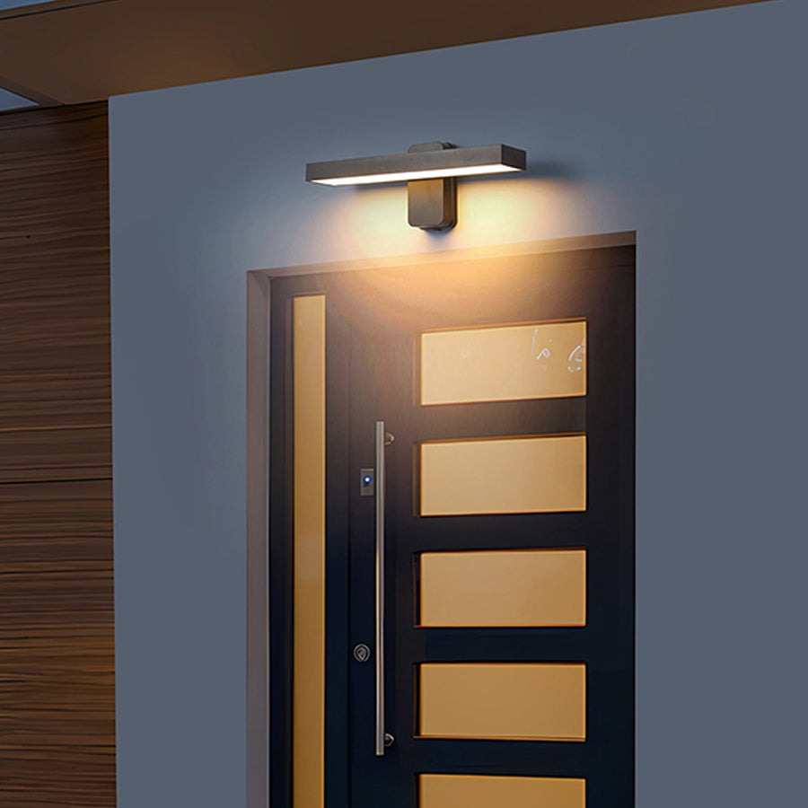 Contemporary wall light with warm glow illuminating modern architectural details