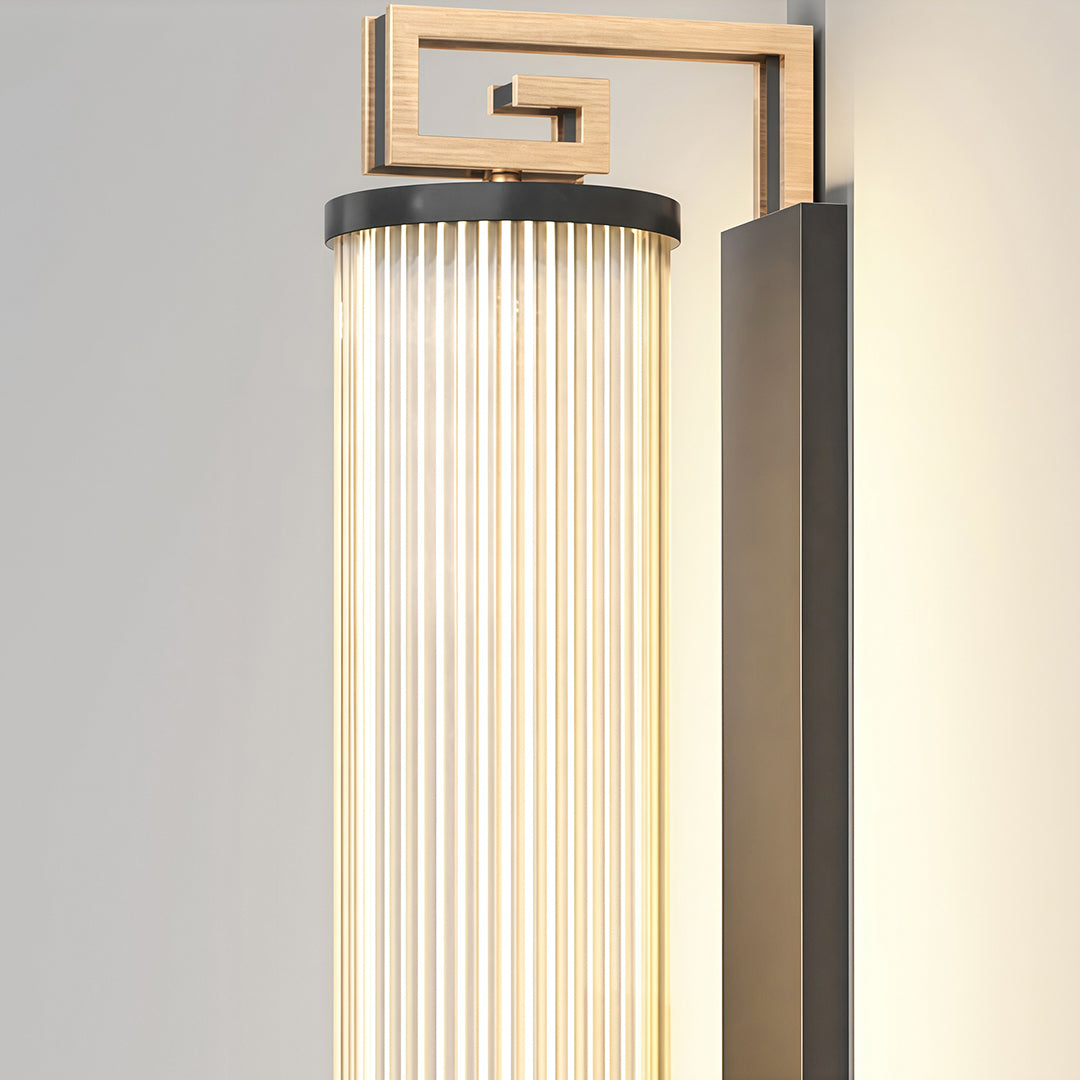 Contemporary wall mounted linear lighting with glass shade chandelier aesthetic shown in detailed cylindrical form with vertical ridged texture.
