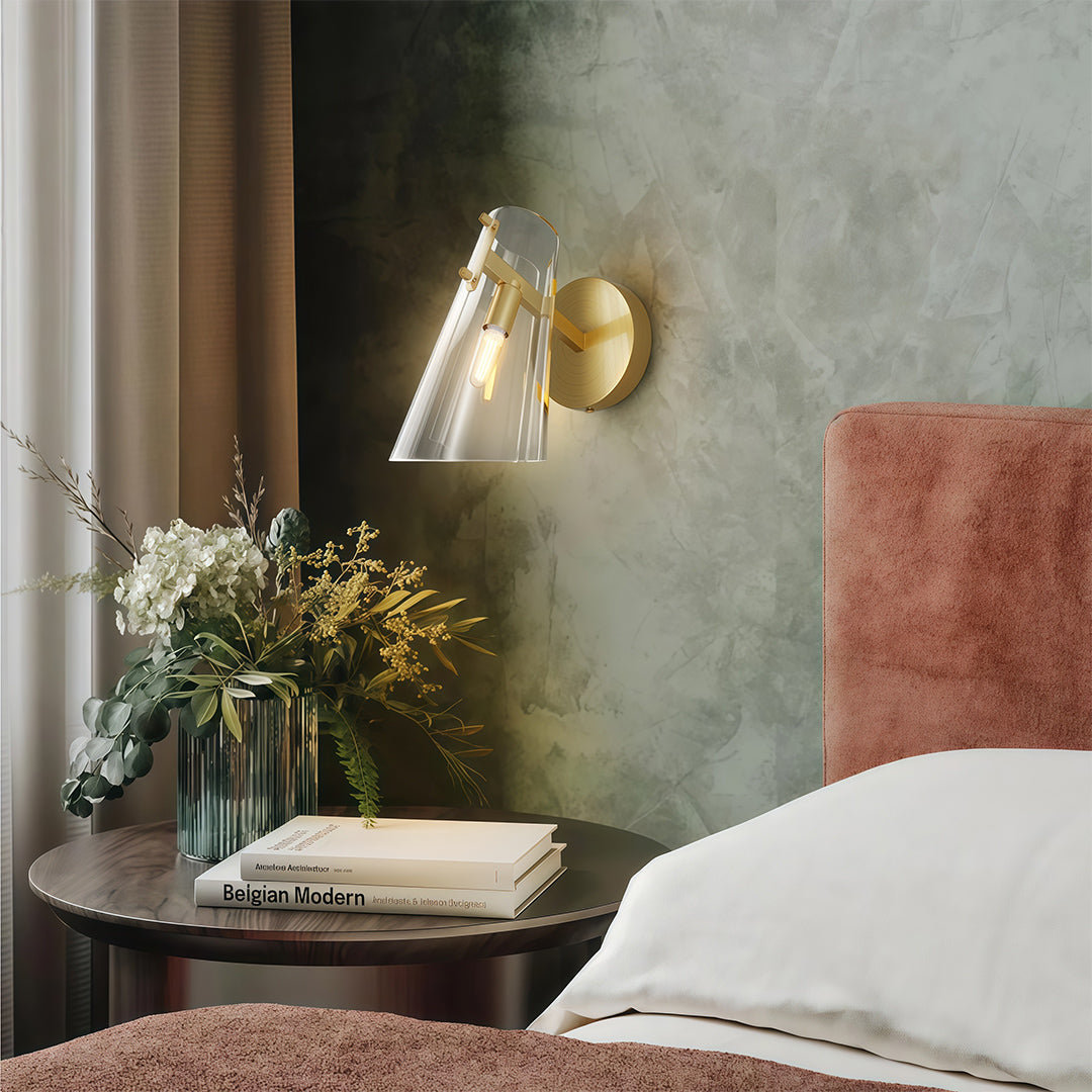 Contemporary wall sconce lighting creating warm ambiance in cozy bedroom with textured wall.