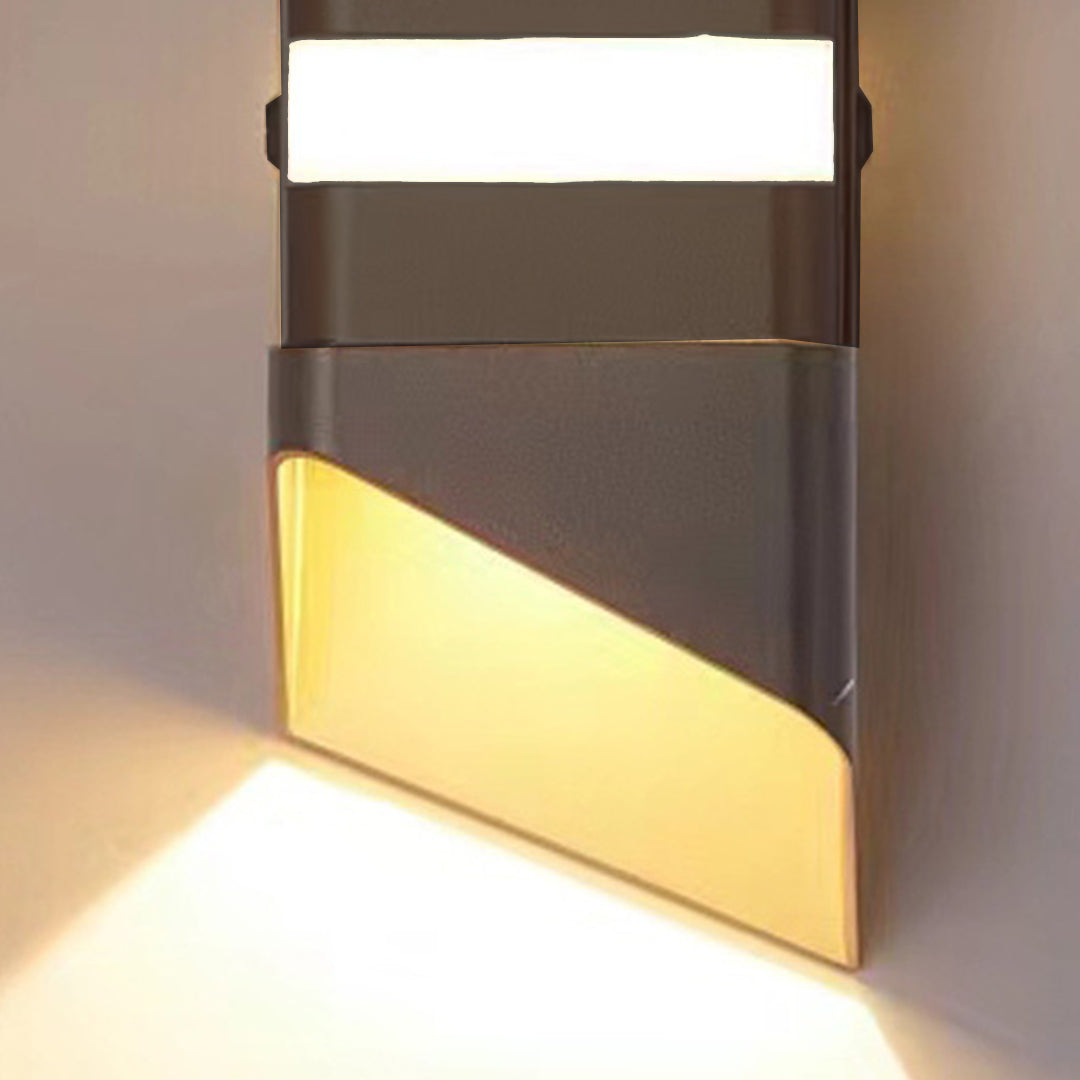 Contemporary wall sconce with warm LED lighting and geometric metal housing design