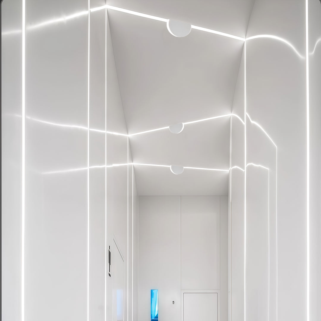 Contemporary white outdoor wall lights featuring glass shade chandelier styling illuminating modern hotel building facade at dusk.