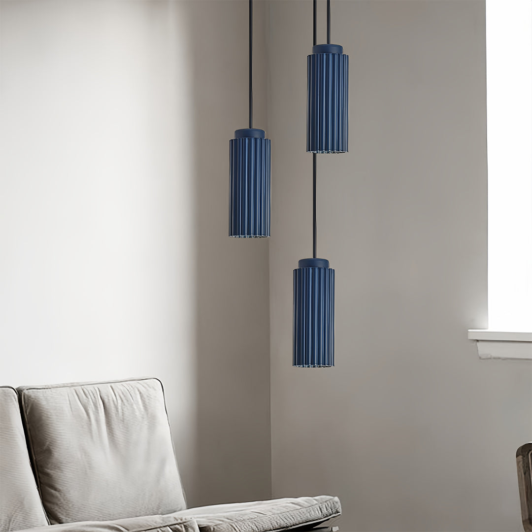 Coordinated blue metal pendants light featuring mixed metal finishes and designs