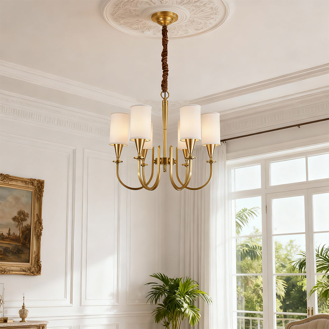 Modern luxury chandeliers illuminating elegant living room with white walls and large windows