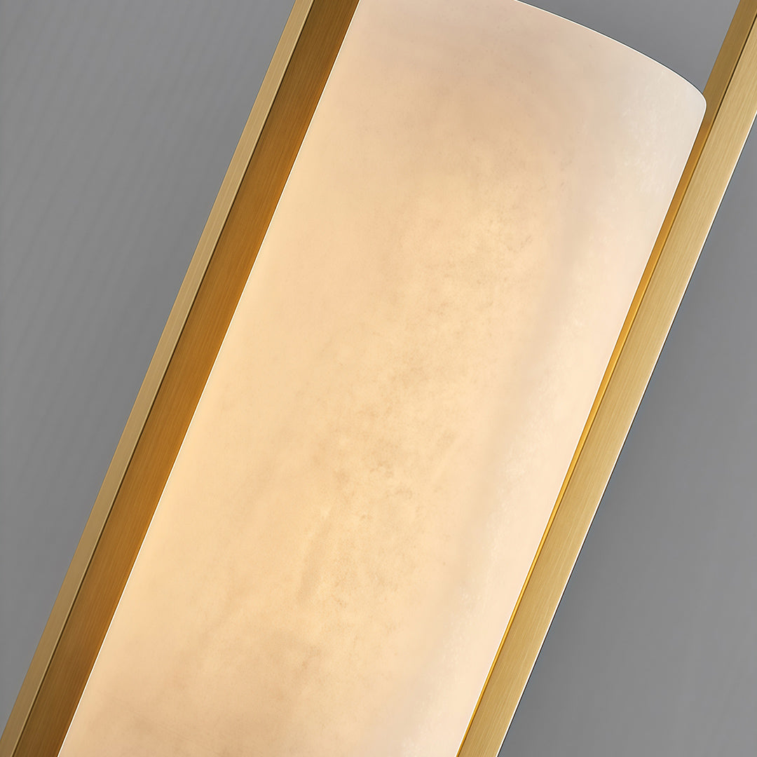 Detail view of copper hanging pendant lights highlighting frosted glass shade and brass edge construction