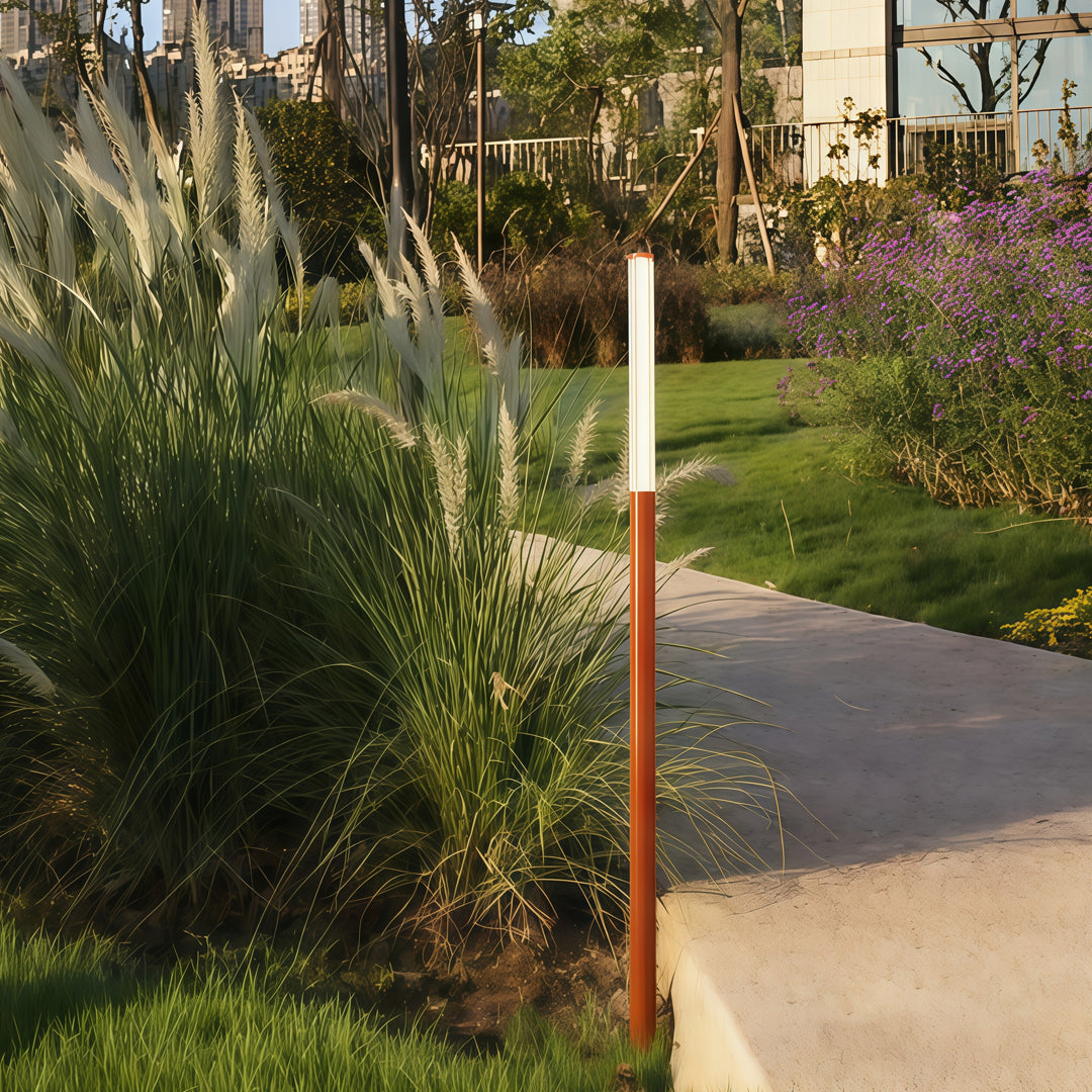 Outdoor pathway with copper led bollard garden light providing warm ambient glow for landscape edges.