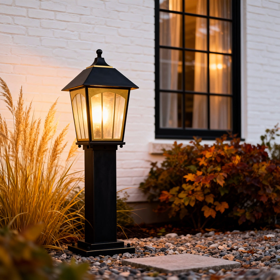 Copper LED path lights placed near a home entrance, enhancing visibility and adding a classic outdoor lighting style.