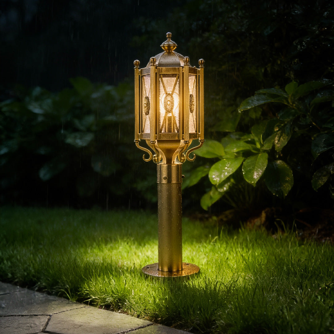 Copper path light casting a soft glow on a curved garden pathway, ideal for landscape and outdoor decor.