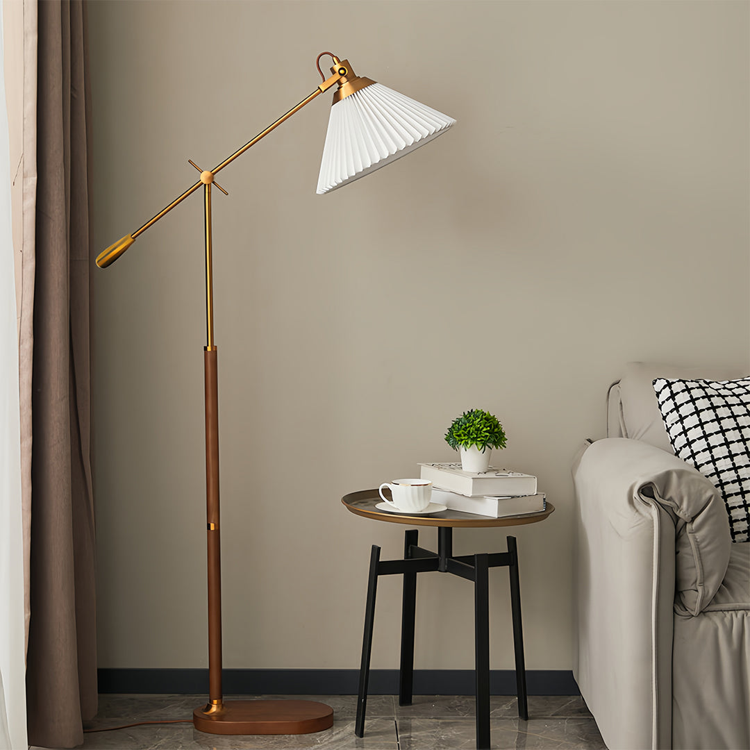 Stylish corner setup featuring small black pendant light with brass accents and comfortable seating area