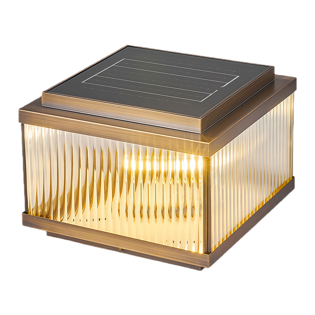 Decorative copper pillar light with vertical corrugated pattern creating ambient outdoor lighting effect