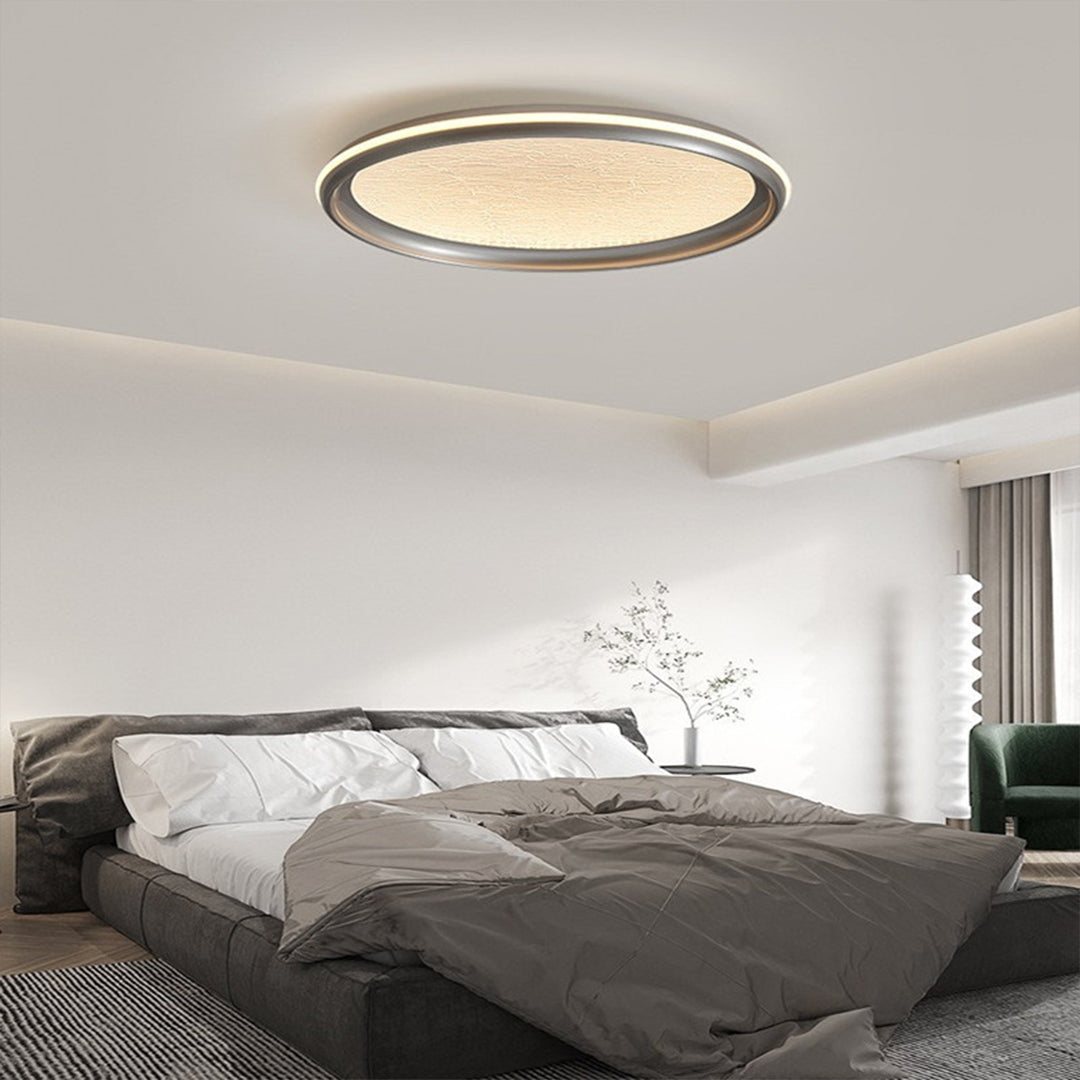 Metal flush mount light in a cozy bedroom, stylish and minimalist ceiling fixture