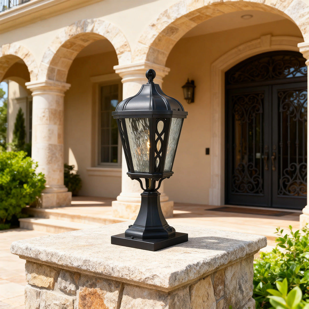 Black post light in a cozy garden entrance, warm and inviting outdoor lighting fixture