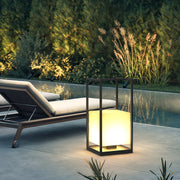 Contemporary outdoor lantern illuminating a garden pathway, creating a cozy and inviting atmosphere.